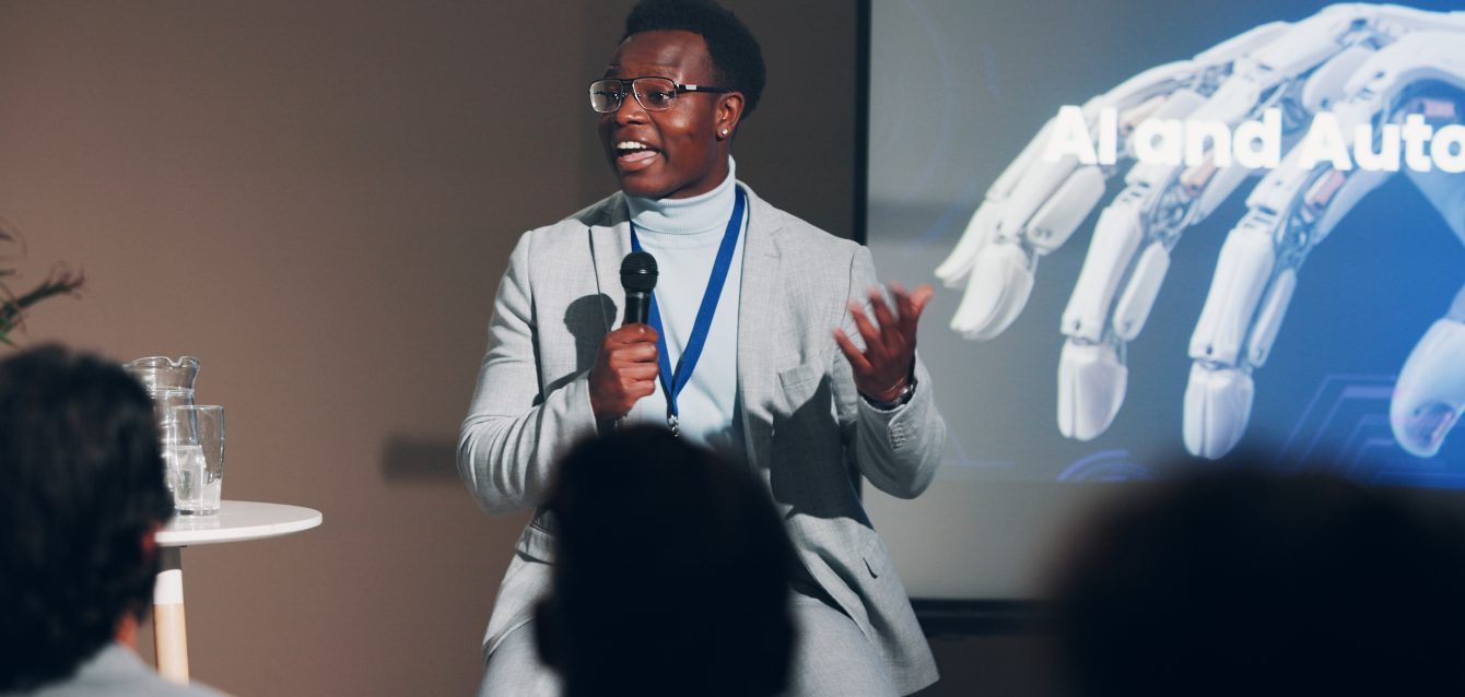 black-man-speaker-and-mic-for-presentation-speech-2026-01-09-11-02-23-utc