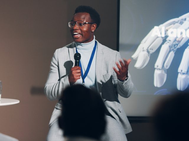 black-man-speaker-and-mic-for-presentation-speech-2026-01-09-11-02-23-utc black-man-speaker-and-mic-for-presentation-speech-2026-01-09-11-02-23-utc