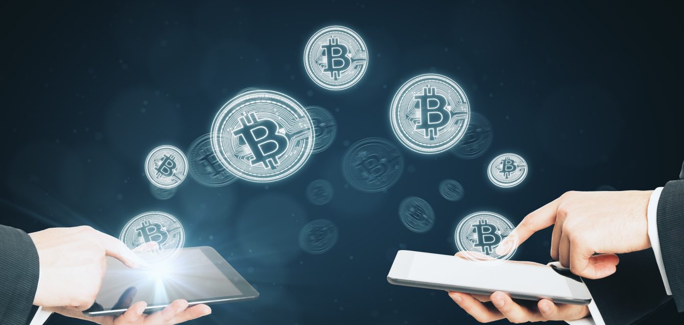 bitcoins-transferring-from-devices-on-blurry-backg-2026-01-11-08-39-32-utc