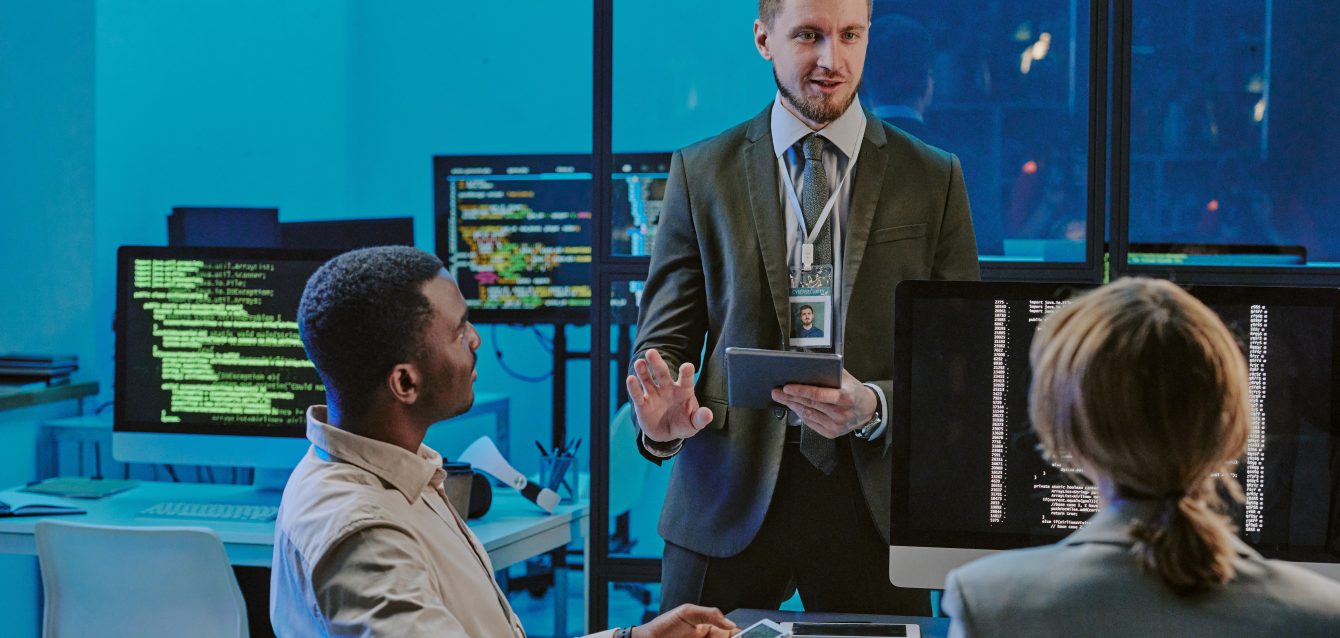 Cybersecurity Specialist Sharing His Ideas During Meeting In Office