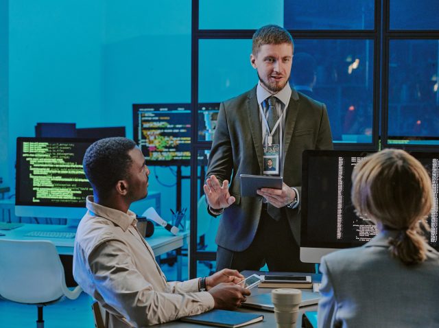 Cybersecurity Specialist Sharing His Ideas During Meeting In Office