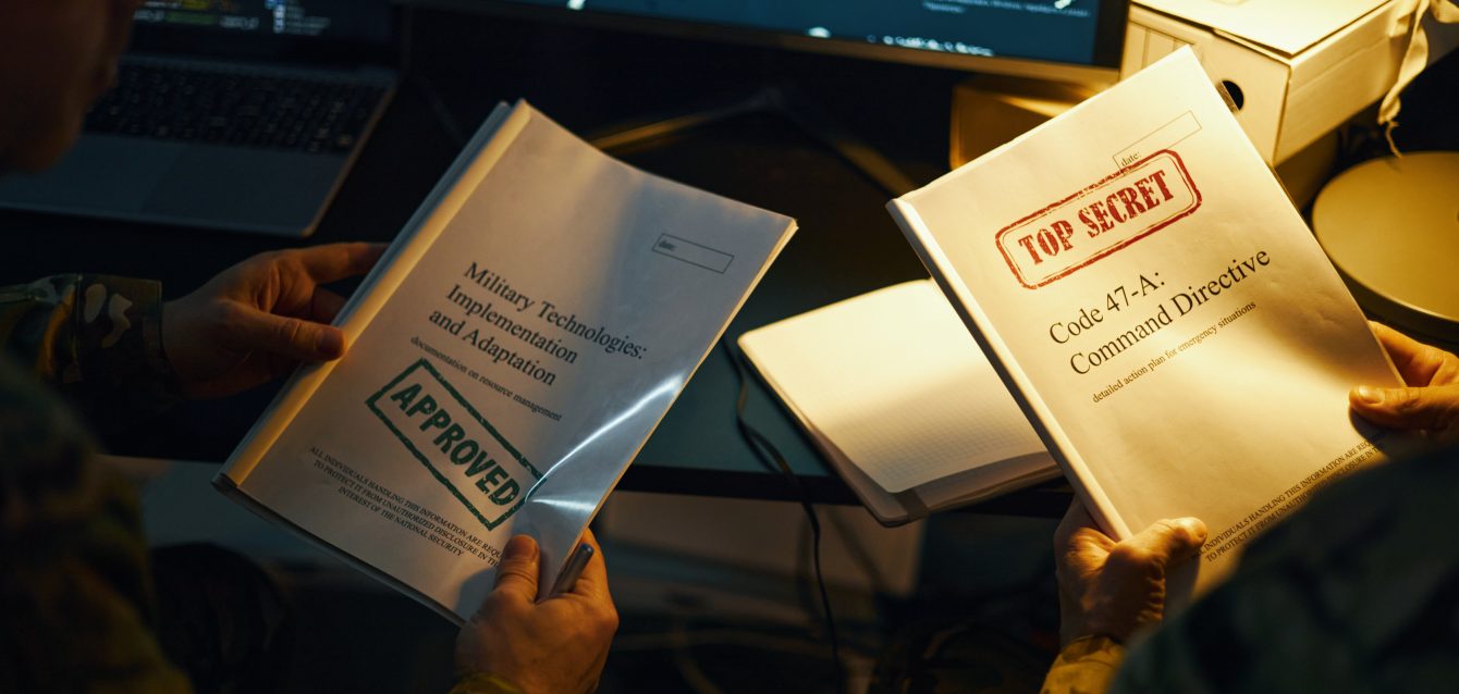 Holding Classified Documents Near Computer Screens Holding Classified Documents Near Computer Screens