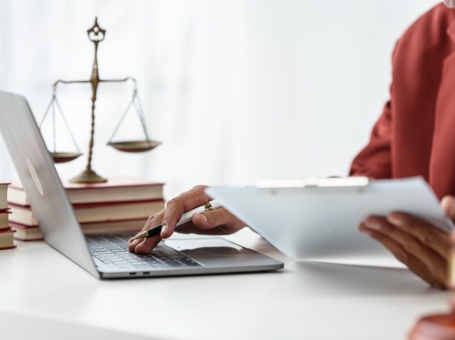 Business man hands close up working with contract lawyers specia