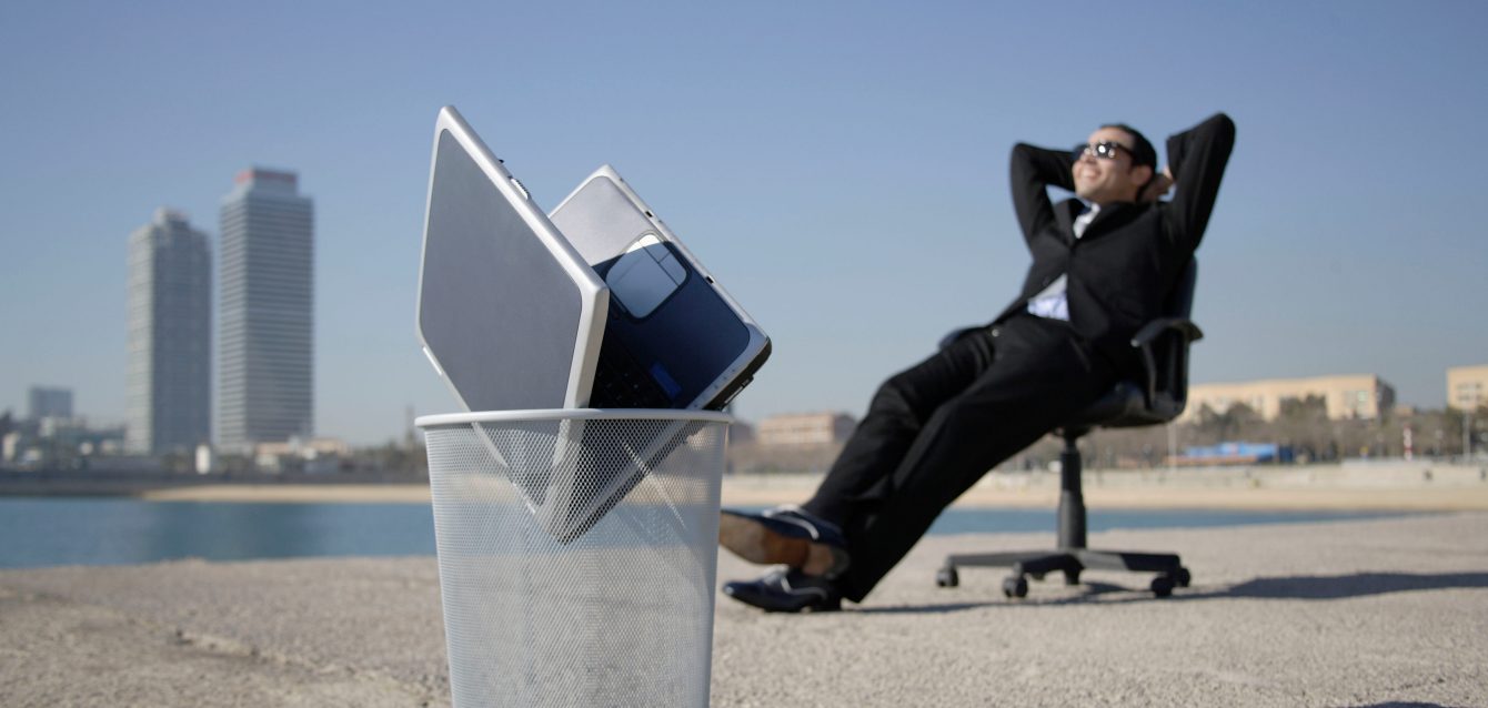 Business man sitting by seafront Business man sitting by seafront