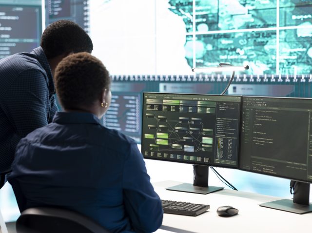 Cyber investigation team working in a governmental hacking room
