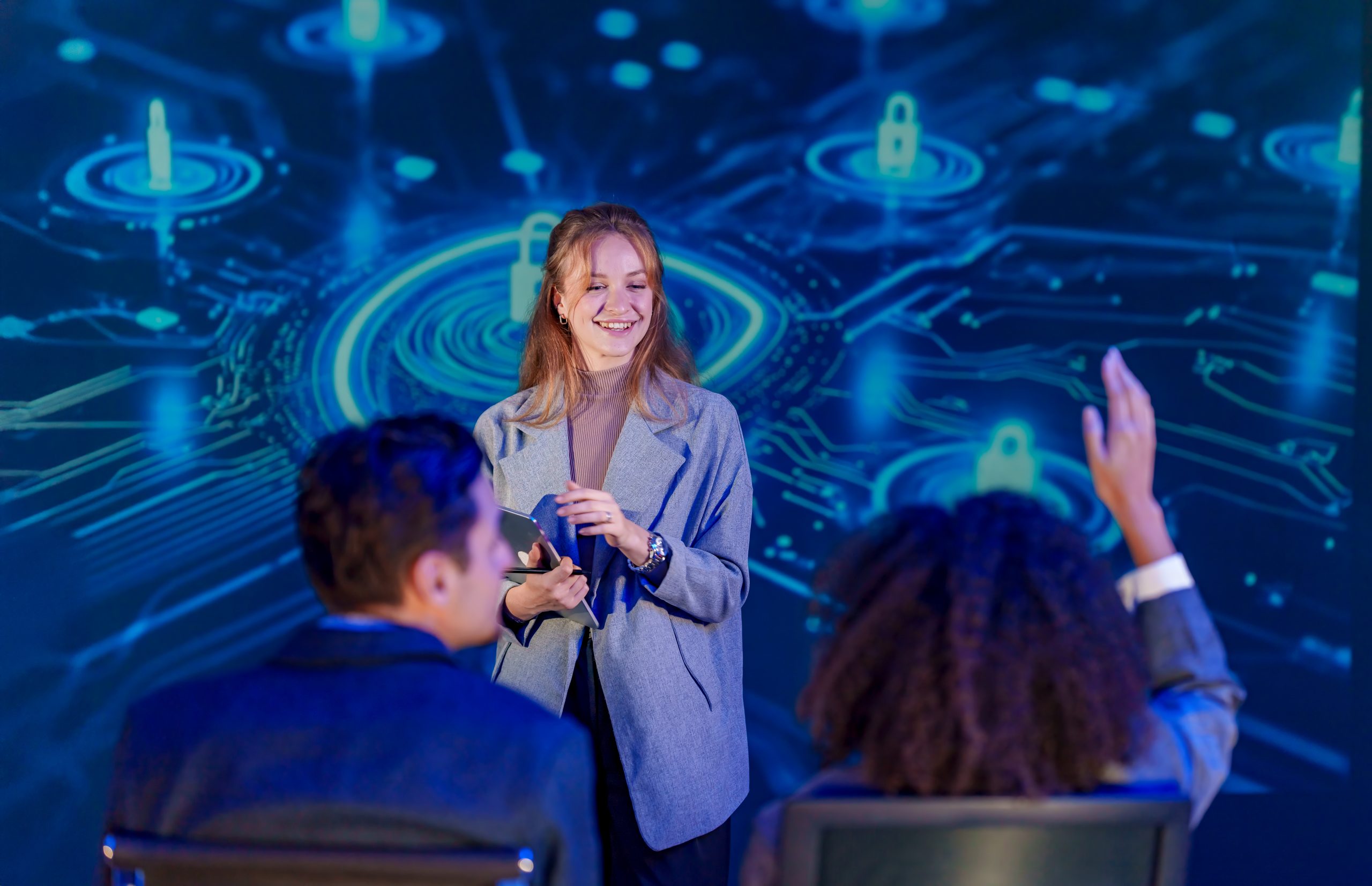 Discussion on technology with audience participation at a conference in fall Discussion on technology with audience participation at a conference in fall