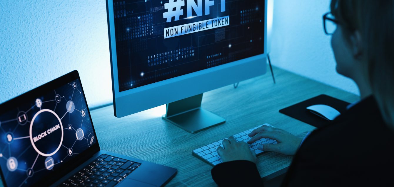 Young woman buying NFT on Blockchain market - New Technology Token Concept - Focus on right computer screen Young woman buying NFT on Blockchain market - New Technology Token Concept - Focus on right computer screen