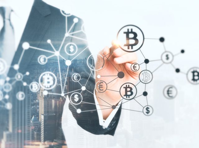 businessman-drawing-creative-bitcoin-hologram-on-a-2026-01-11-08-45-45-utc