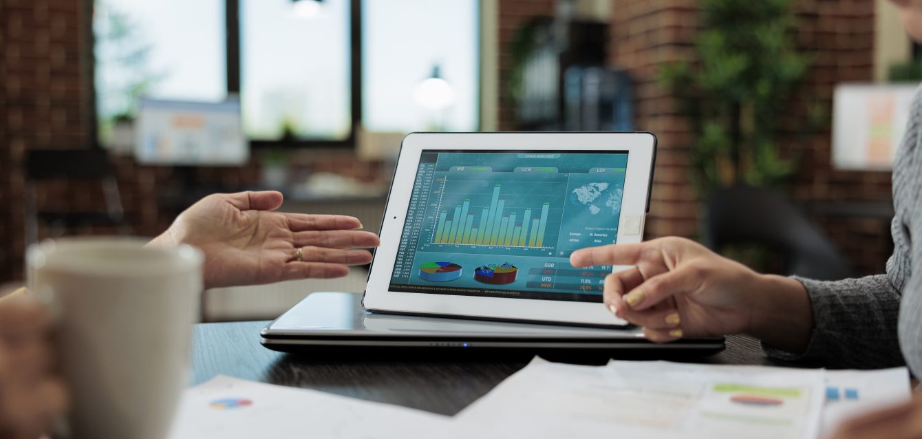 Clsoe up of digital tablet with management graphs on display