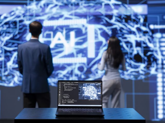 IT engineers using artificial intelligence augmented reality hologram