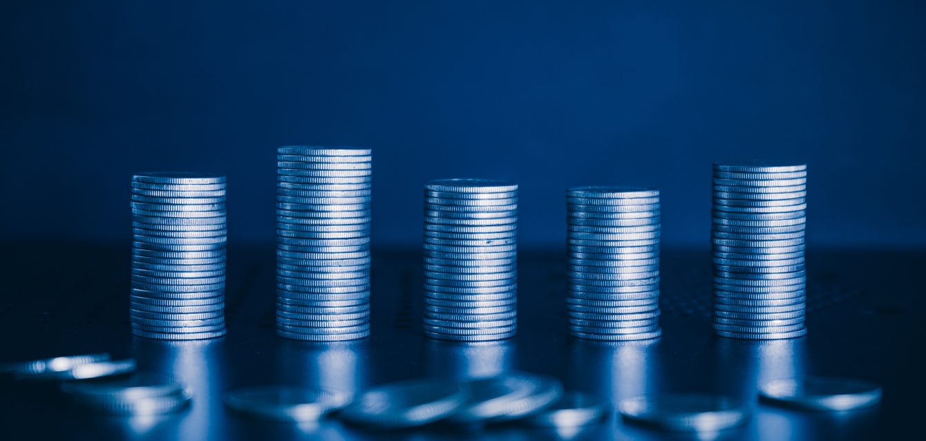 money-coin-on-desk-background-with-blue-filter-bu-2026-01-06-10-11-21-utc money-coin-on-desk-background-with-blue-filter-bu-2026-01-06-10-11-21-utc