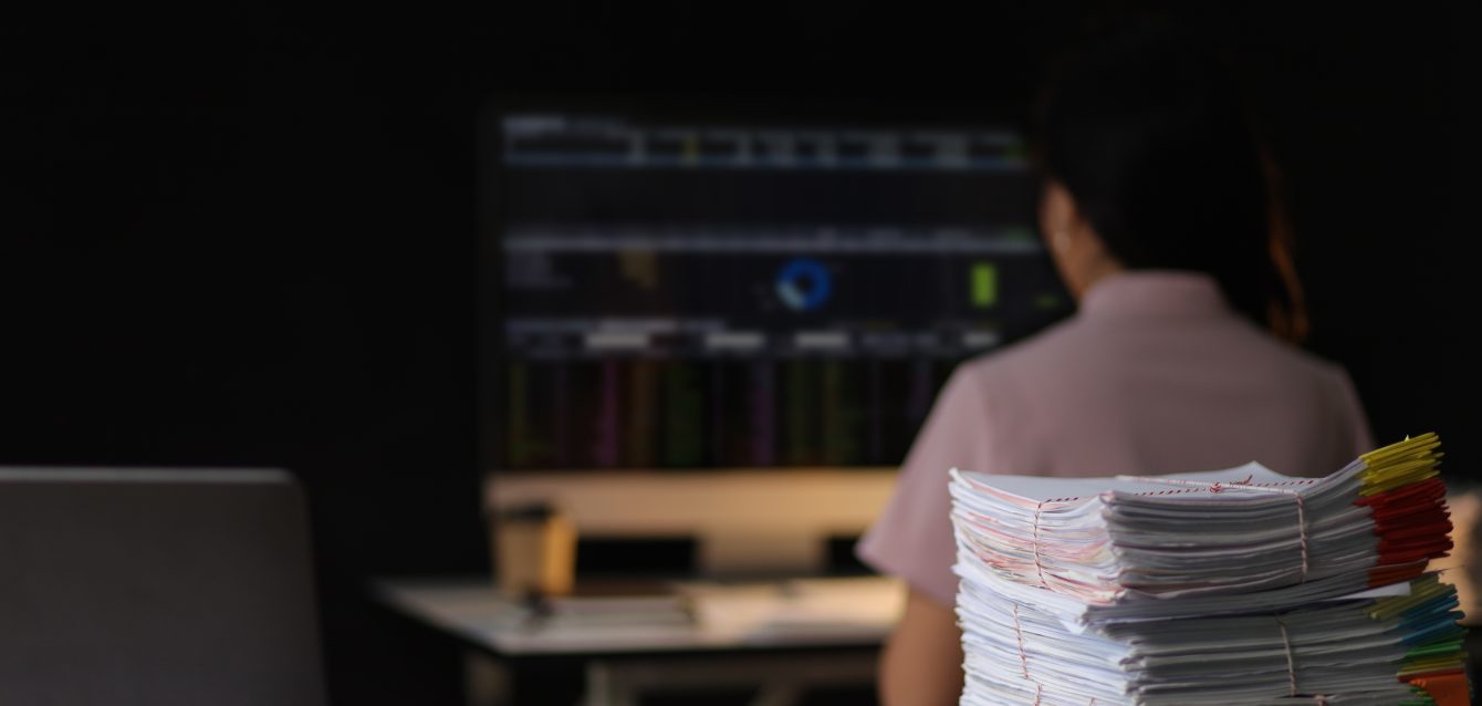 woman-working-with-computers-and-documents-in-the-2026-01-09-10-49-42-utc woman-working-with-computers-and-documents-in-the-2026-01-09-10-49-42-utc