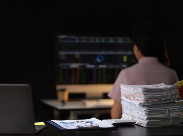 woman-working-with-computers-and-documents-in-the-2026-01-09-10-49-42-utc