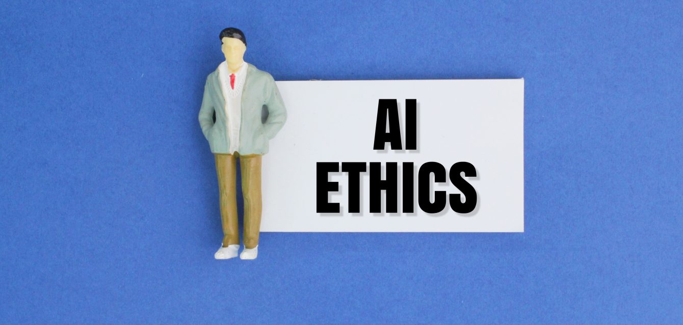 miniature-people-and-paper-with-the-word-ai-ethics-2026-01-08-06-20-41-utc