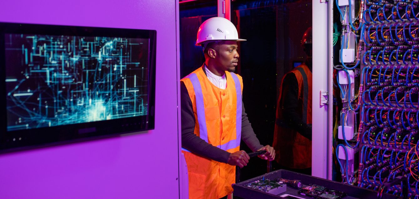 Security System Engineer Pushing Cart with Server Components